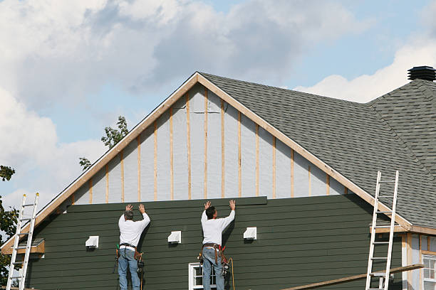 Professional Vinyl Siding technician working in Harrison, NJ